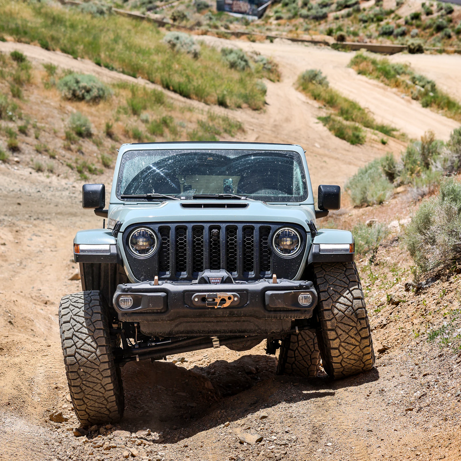 Canon EOS R8 photograph of a Jeep Wrangler flexing through a steep dirt rut in Bountiful Canyon, Utah.
